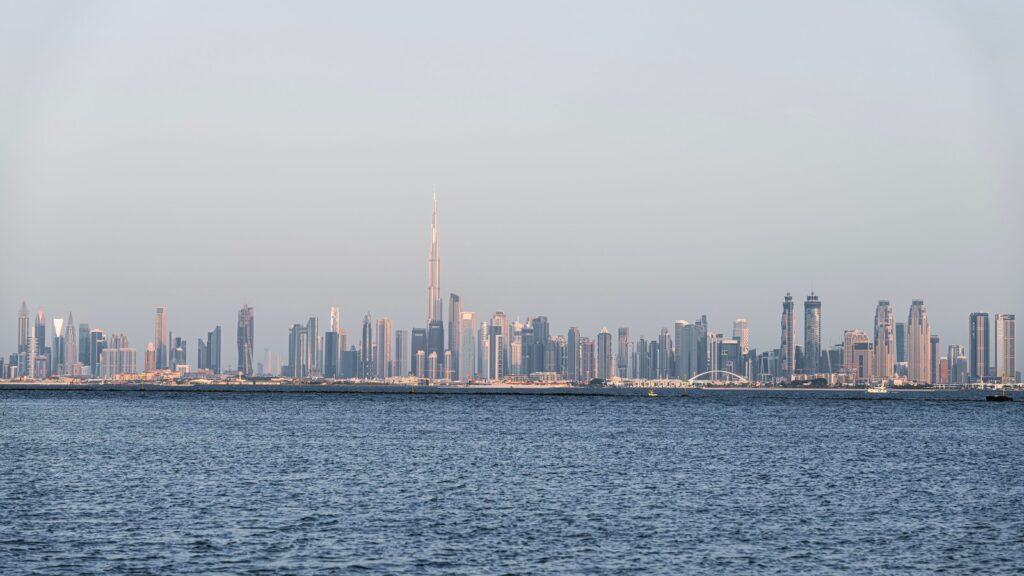 Dubai skyline view across the water with Burj Khalifa and Downtown Dubai towers, representing the wider Al Jaddaf/Dubai Healthcare City area near Binghatti Gateway