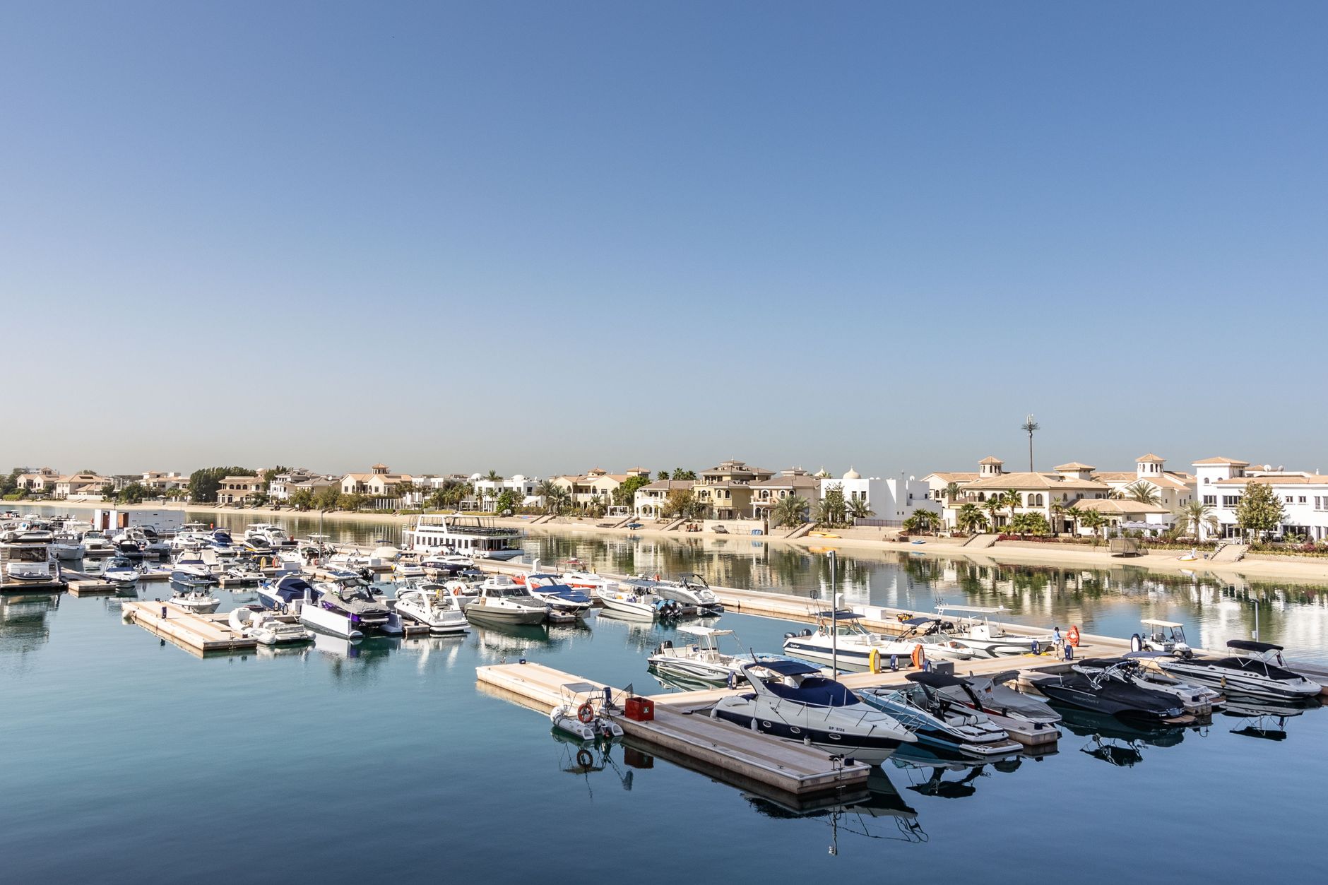 Marina and waterfront villas along a Palm Jumeirah canal, Dubai