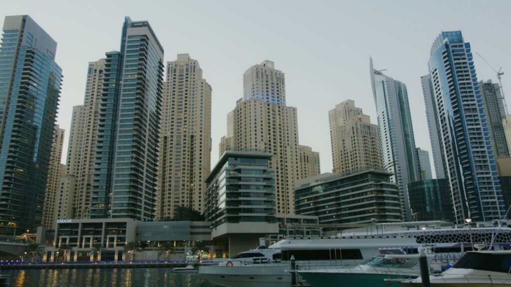 Dubai Marina apartment tower skyline near the water at dusk, no people visible