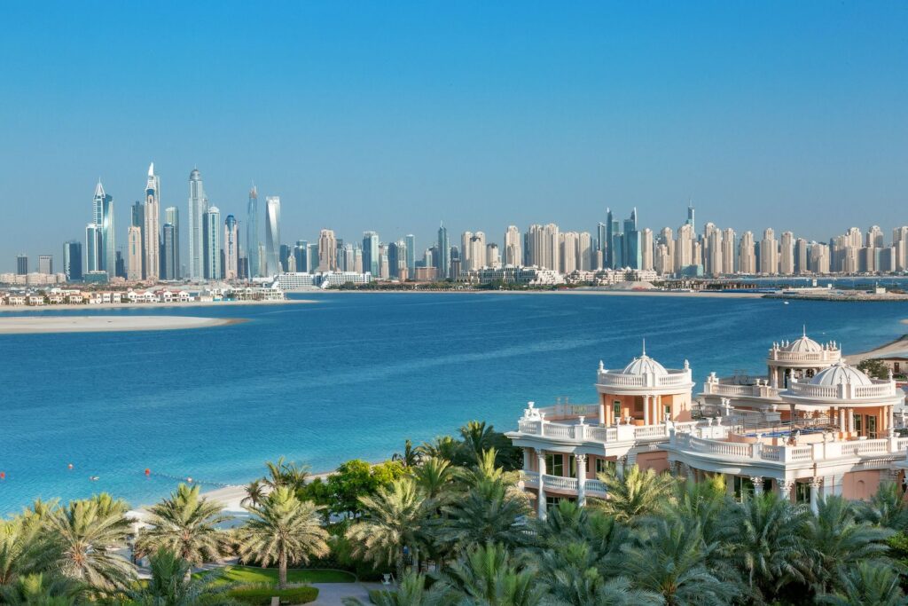 Dubai Marina skyline with Palm Jumeirah in the background, representative of the Emaar Beachfront peninsula's waterfront location