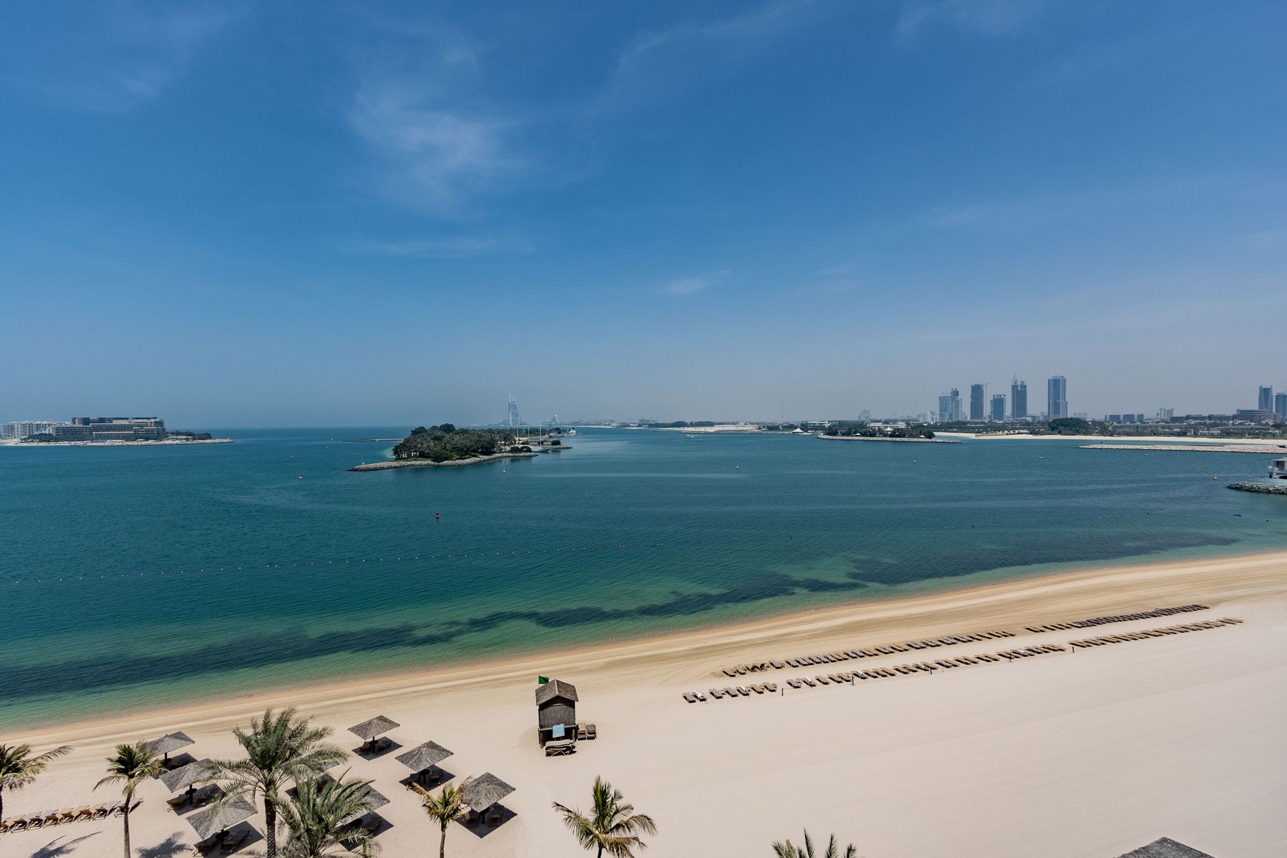 Aerial view of a Palm Jumeirah beach frond with Dubai skyline, Dubai