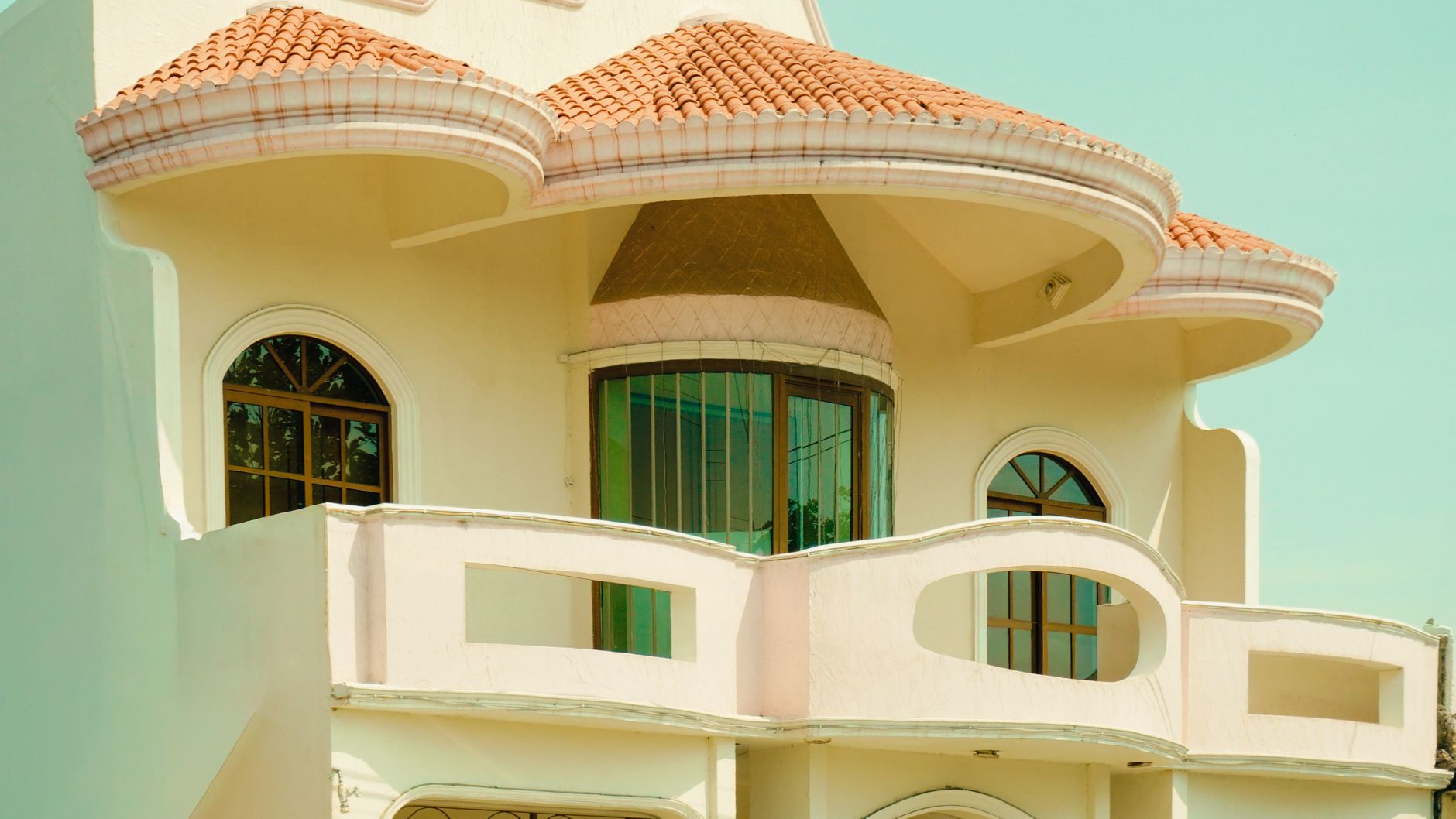 Cream Mediterranean-style villa with a terracotta-tiled domed roof, Palm Jumeirah, Dubai
