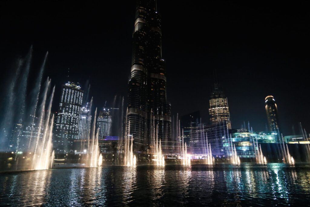 Illuminated Dubai skyline at night with Burj Khalifa and Dubai Fountain, near Imperial Avenue, Downtown Dubai