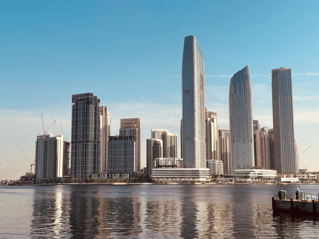 Modern Dubai skyscrapers reflecting on the waterfront skyline near Business Bay