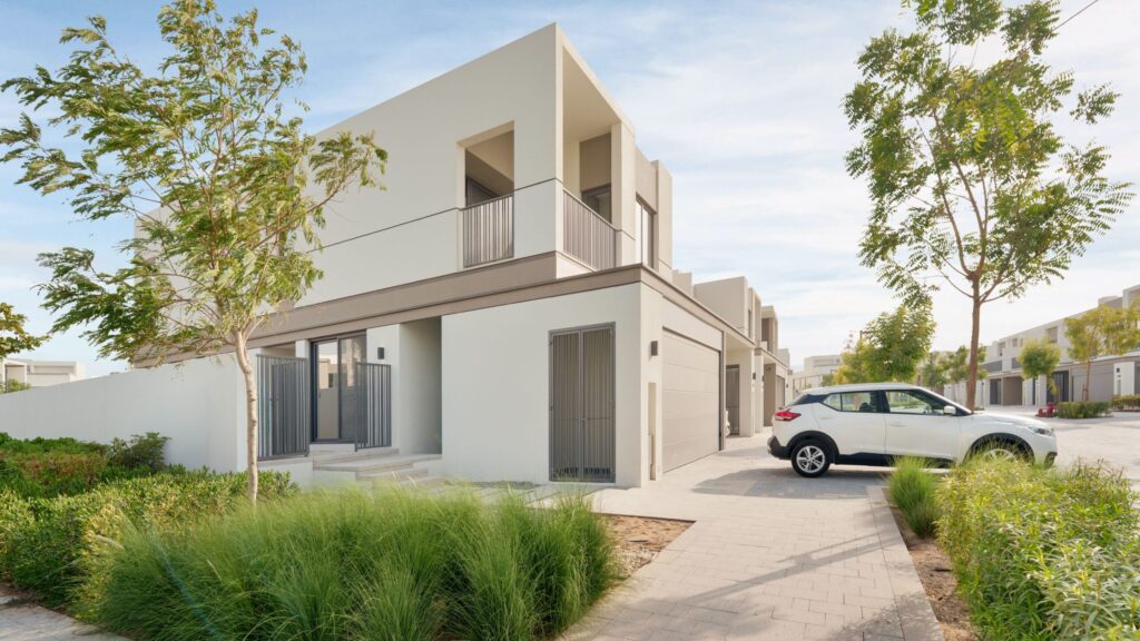 Modern townhouse exterior on a quiet street in a Dubai villa community, MAG City MBR City