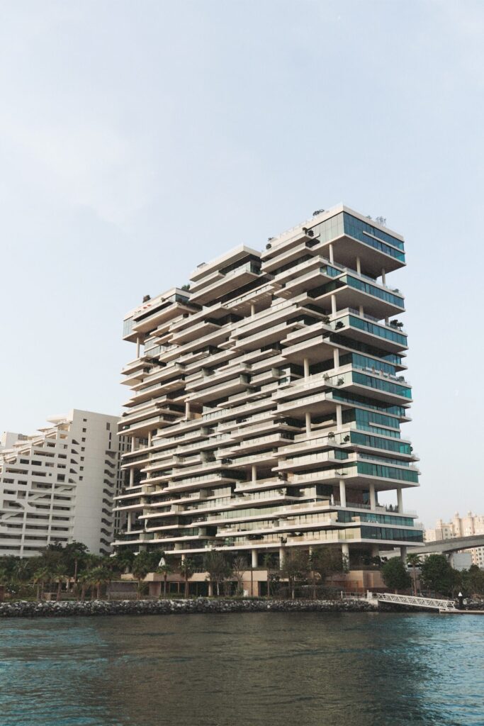 Striking contemporary high-rise residential tower with cantilevered balconies by the waterfront