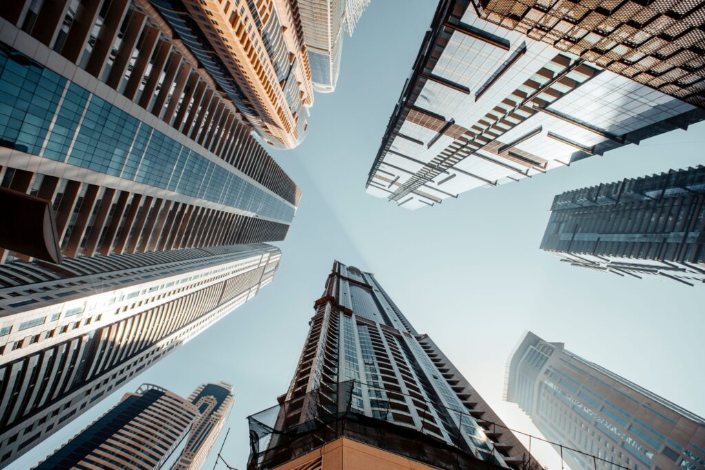 Low angle photograph of high-rise residential towers against a clear sky