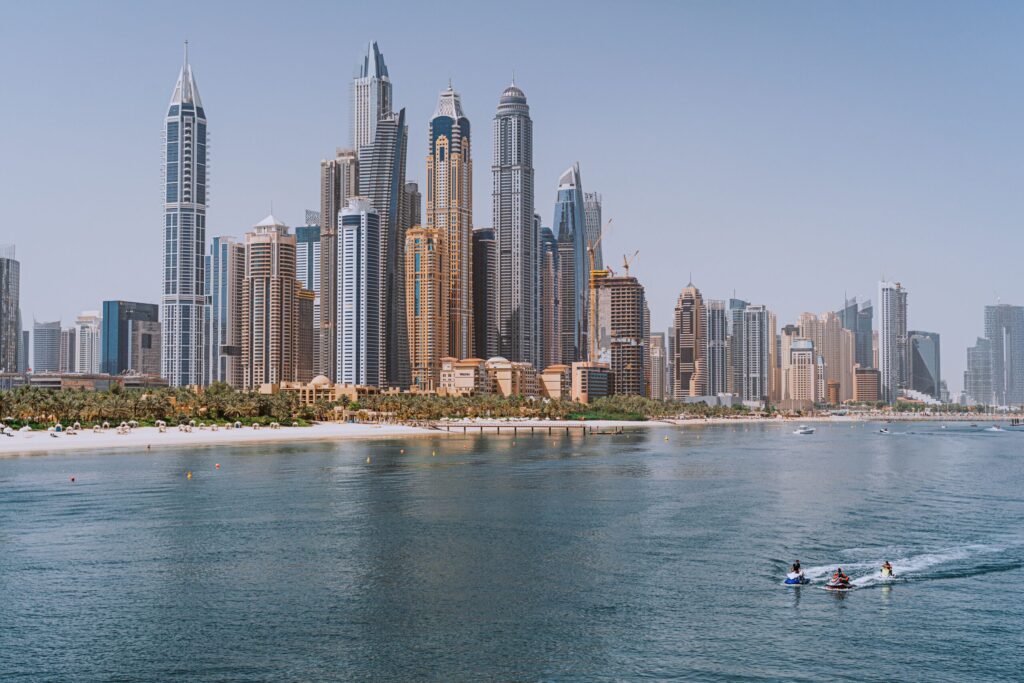 Modern glass high-rise towers beside the water in Dubai, close to Beach Vista Tower 1, Emaar Beachfront