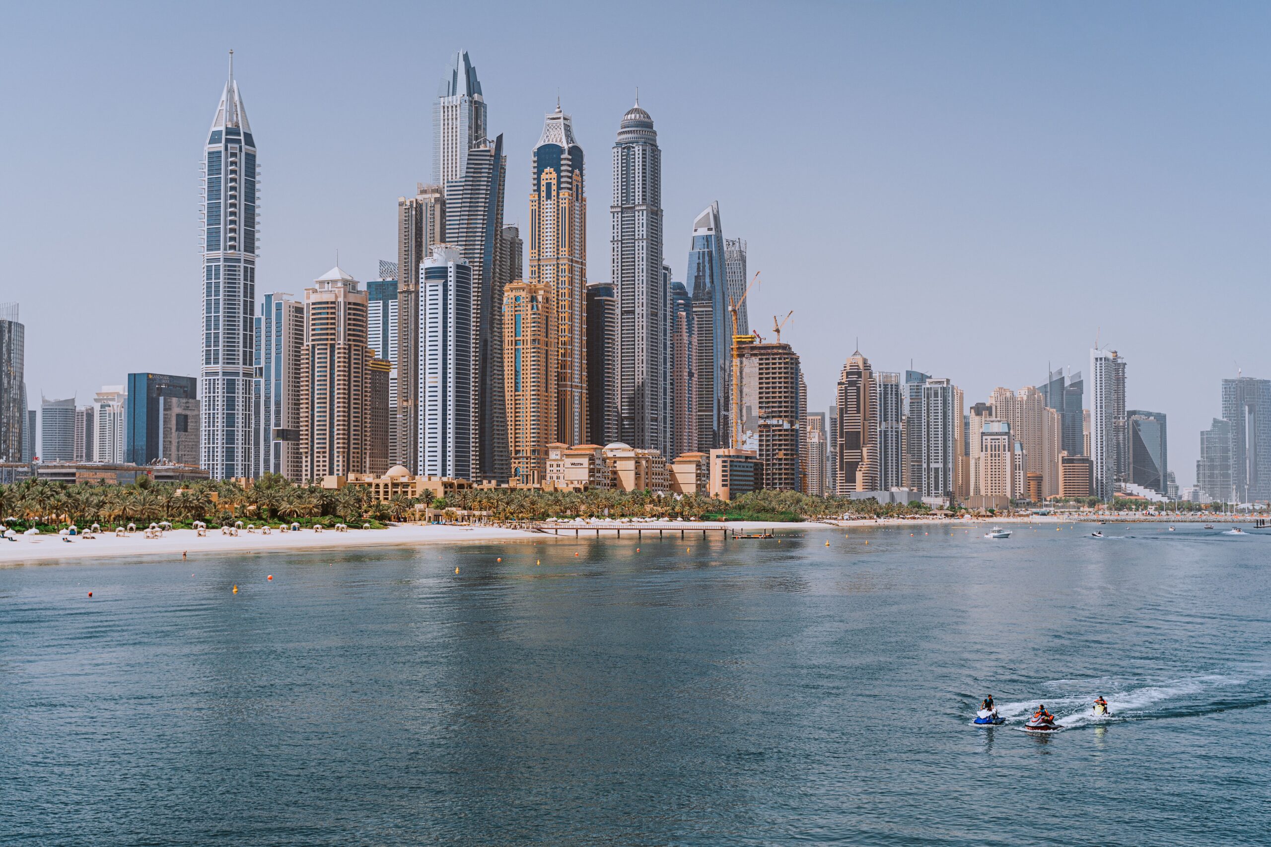 Modern glass high-rise towers beside the water in Dubai, close to Beach Vista Tower 1, Emaar Beachfront