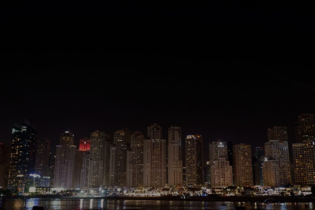 Night skyline over the Dubai Marina canal near La Riviera Tower