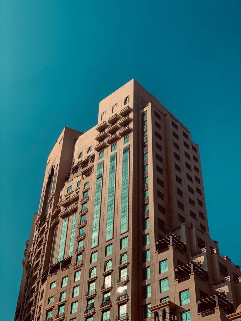 Modern residential tower against a clear blue sky in Dubai