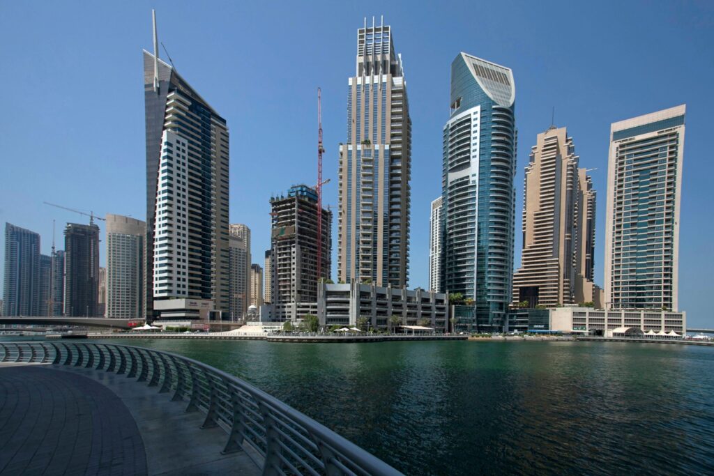 Dubai Marina waterfront skyline with high-rise towers seen from the sea on a clear day