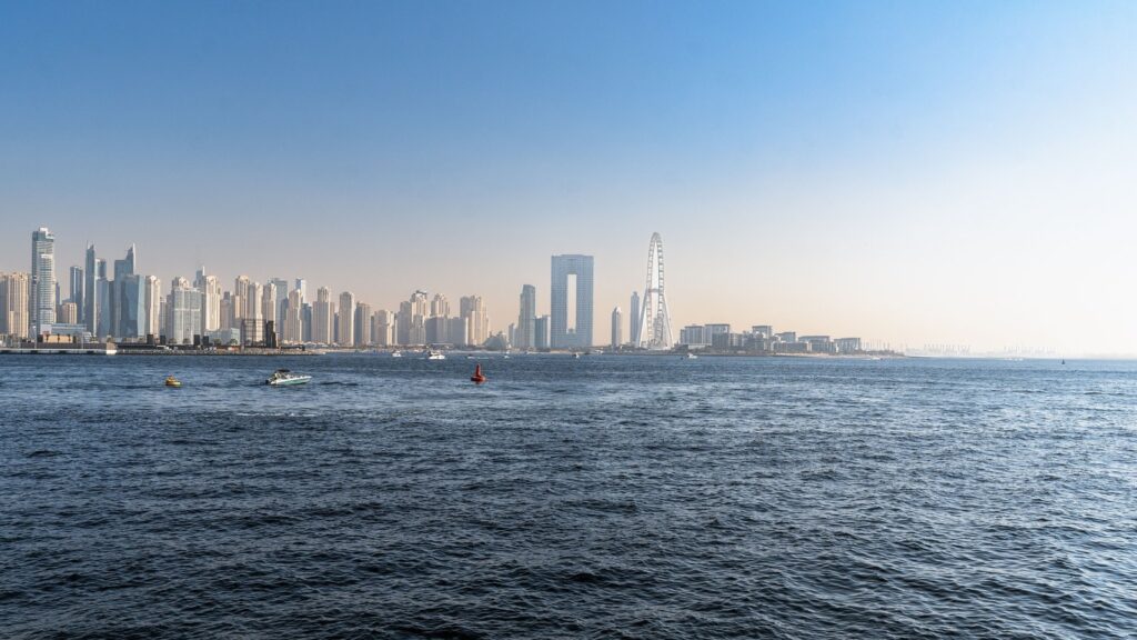 Dubai coastal skyline seen from the sea, with the Ain Dubai observation wheel and JBR-area towers