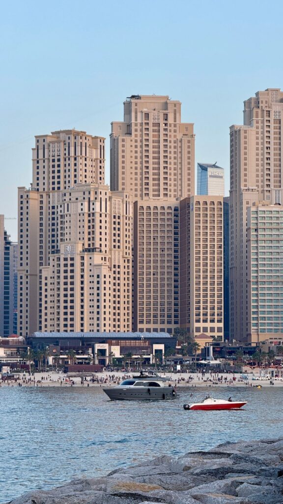 Beachfront apartment towers in JBR Dubai viewed from the water in daylight