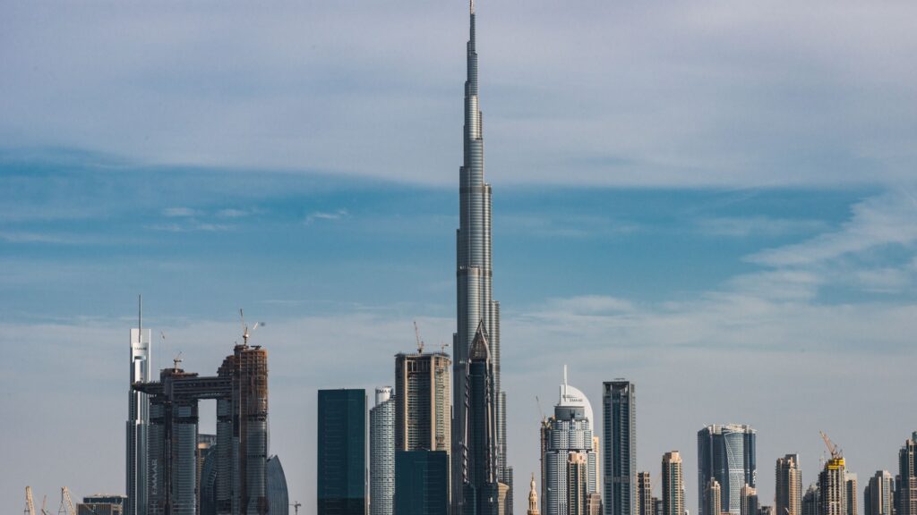 Downtown Dubai skyline in daylight with the Burj Khalifa towering above surrounding Emaar-developed high-rise towers