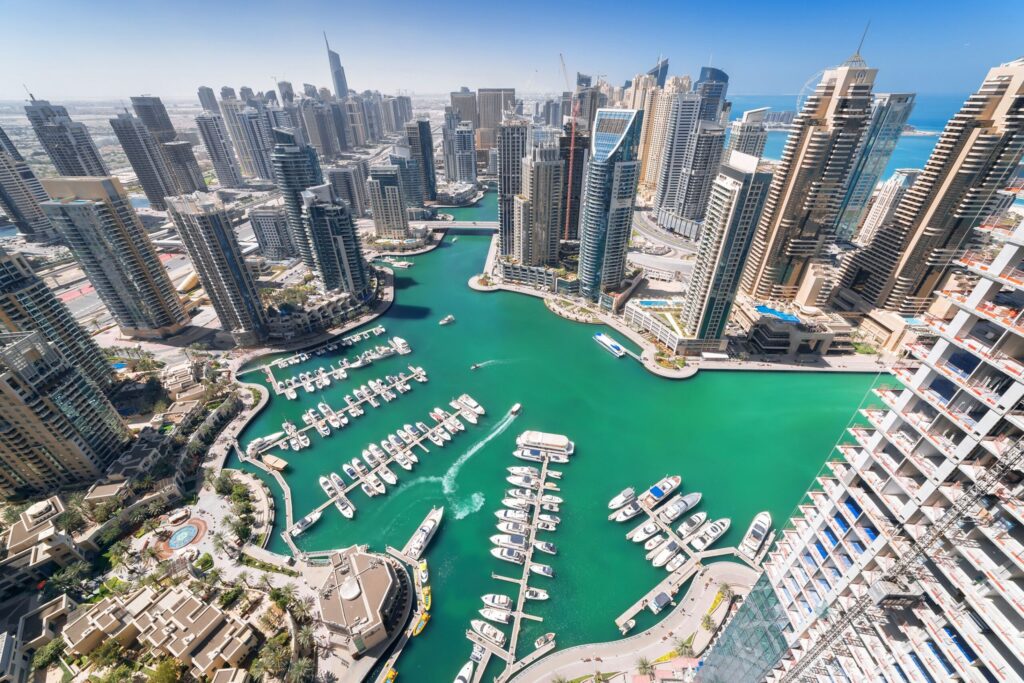Daytime aerial view of Dubai Marina with yacht marina and glass towers, near The Residence at Marina Gate 2, Dubai Marina