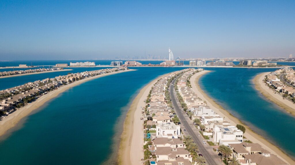 Aerial view of a Palm Jumeirah frond lined with villas and the sea on both sides