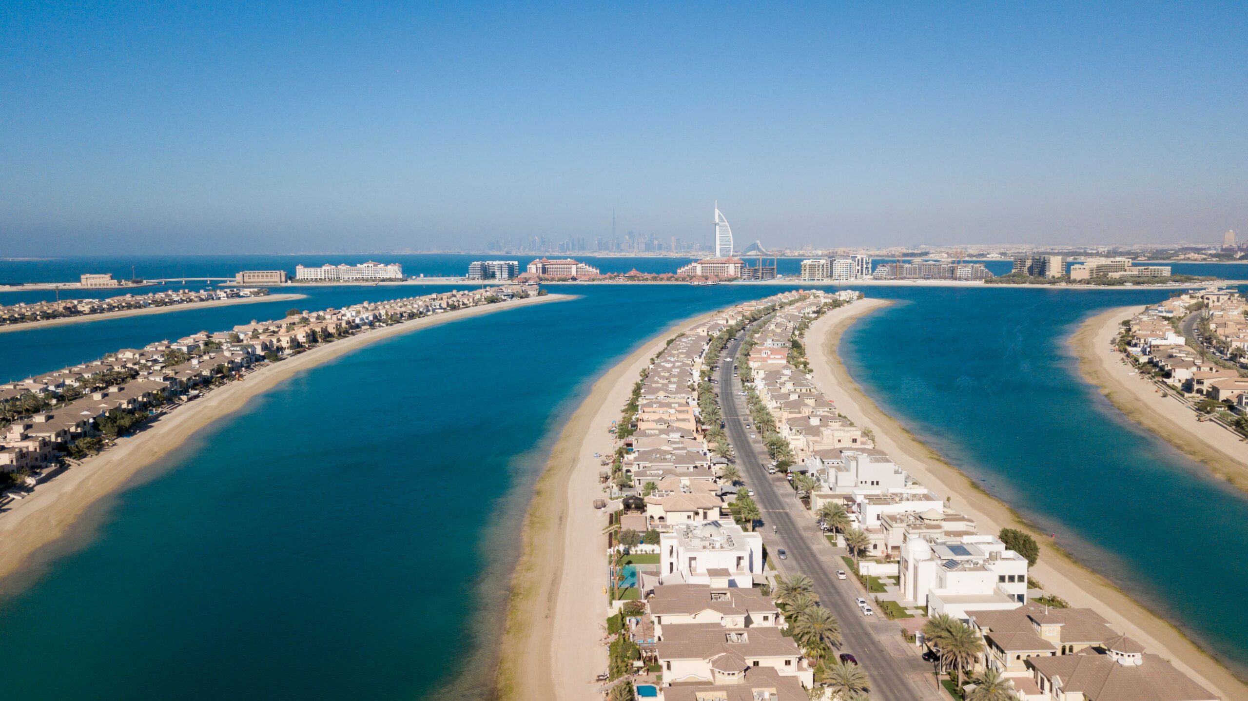 Aerial view of a Palm Jumeirah frond lined with villas and the sea on both sides