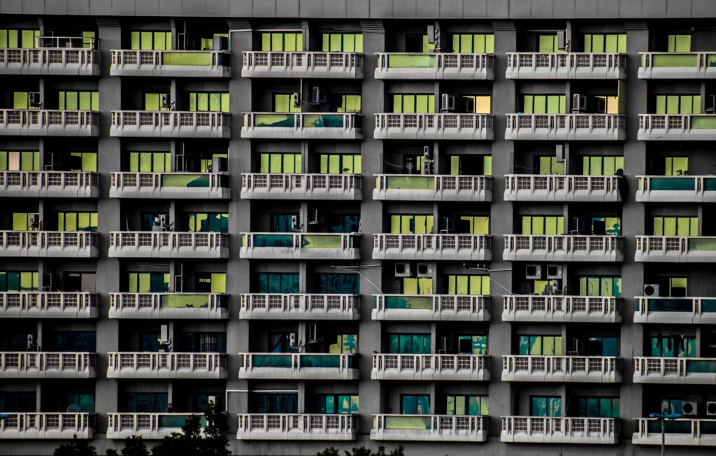 Close-up facade of a Dubai residential building with balconies near Diamond Views 4, JVC