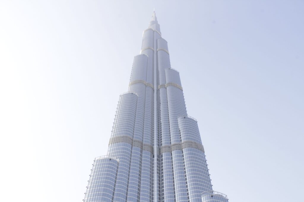 Low angle view of Burj Khalifa against a clear sky, near Burj Al Nujoom in the Burj Khalifa Area, Downtown Dubai
