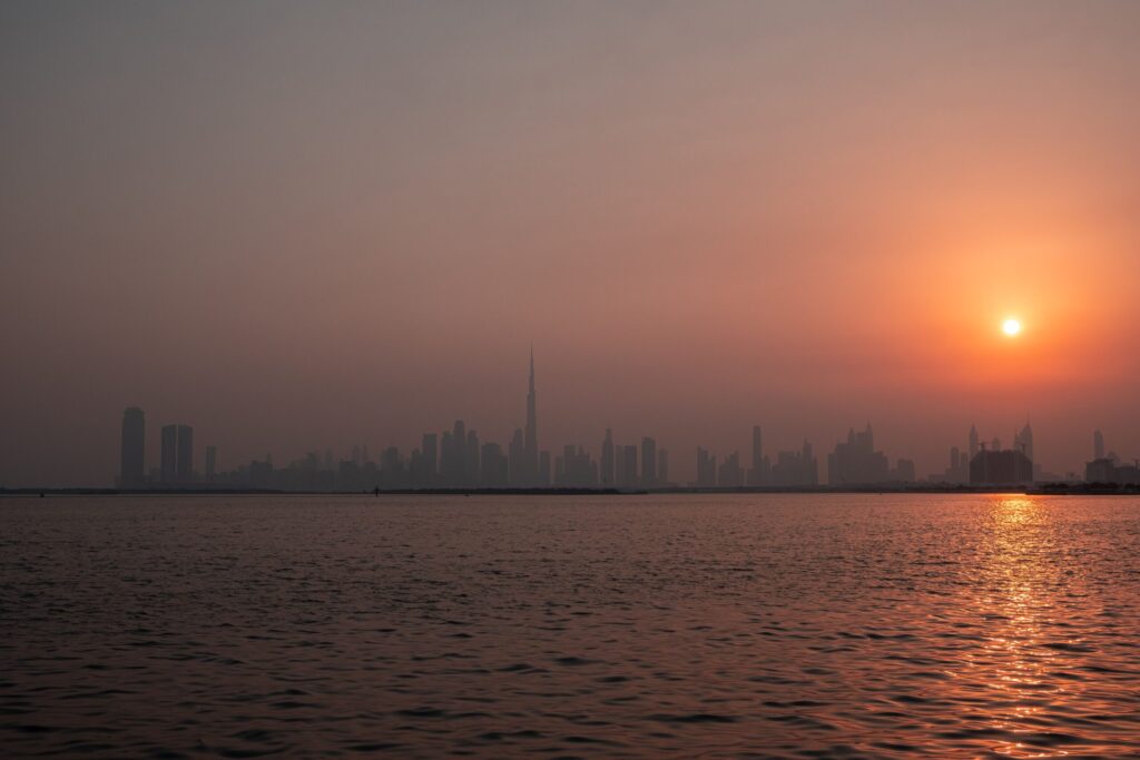 Dubai skyline with the sun rising over the waterfront