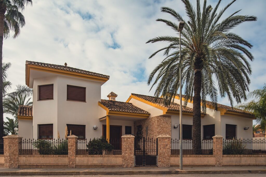 Mediterranean-style villa with palm trees and terracotta roof near Mirabella 3, JVC
