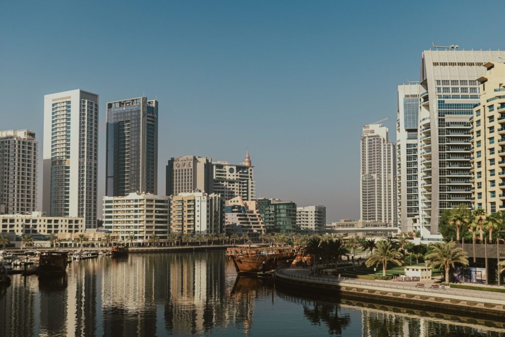 Yachts moored in Dubai Marina with residential towers in the background