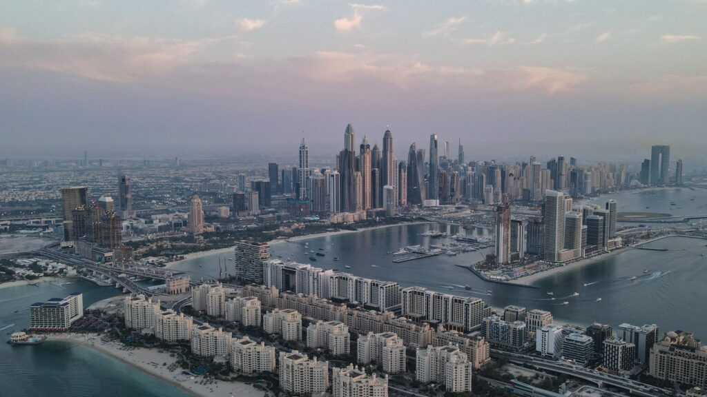 Aerial view of the Dubai coastline and skyline at dusk
