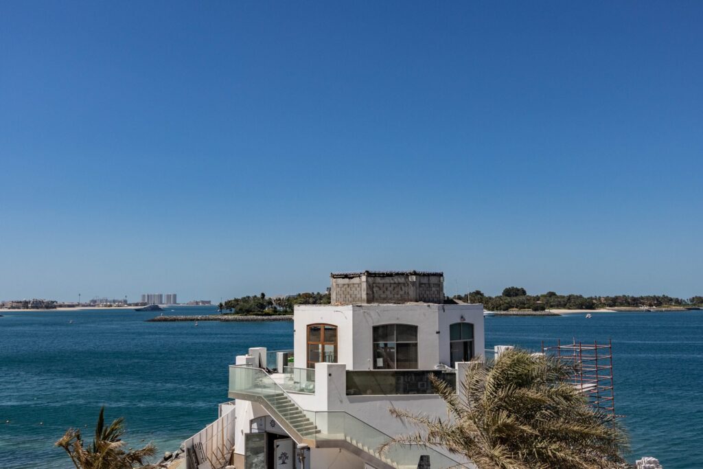 Waterfront villa rooftop terrace overlooking a lagoon near District One West, MBR City