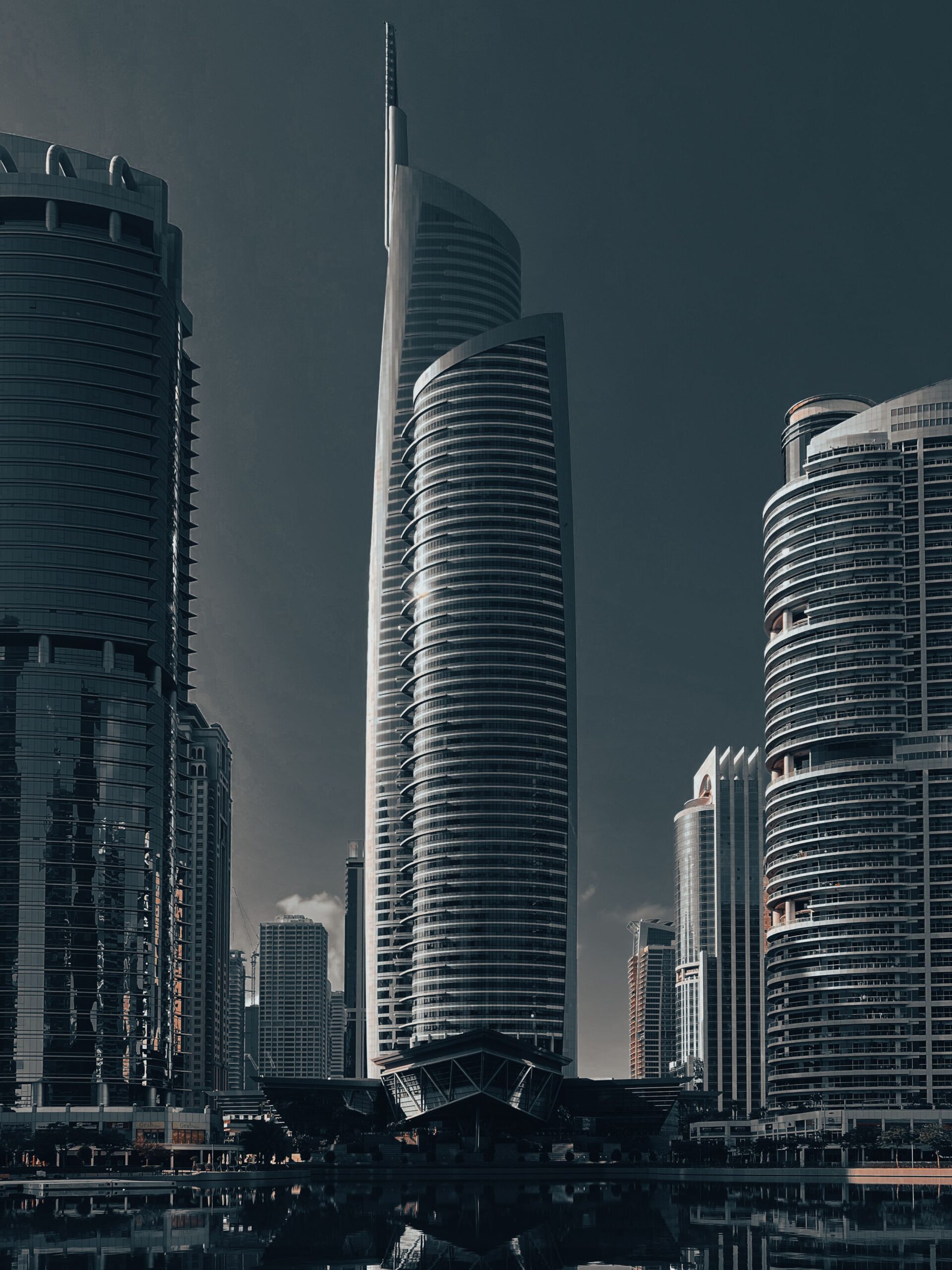 Dramatic view of Almas Tower rising above the Jumeirah Lake Towers skyline in Dubai