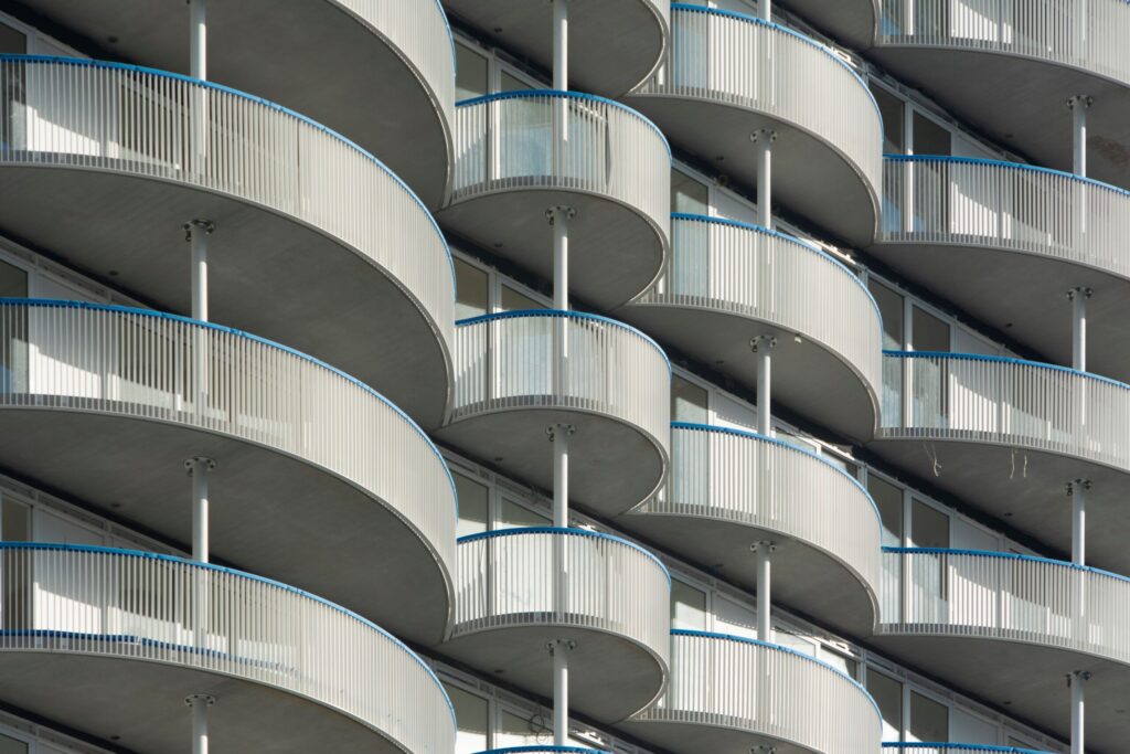 Close-up of curved modern apartment balconies, similar to Wilton Terraces, Sobha Hartland