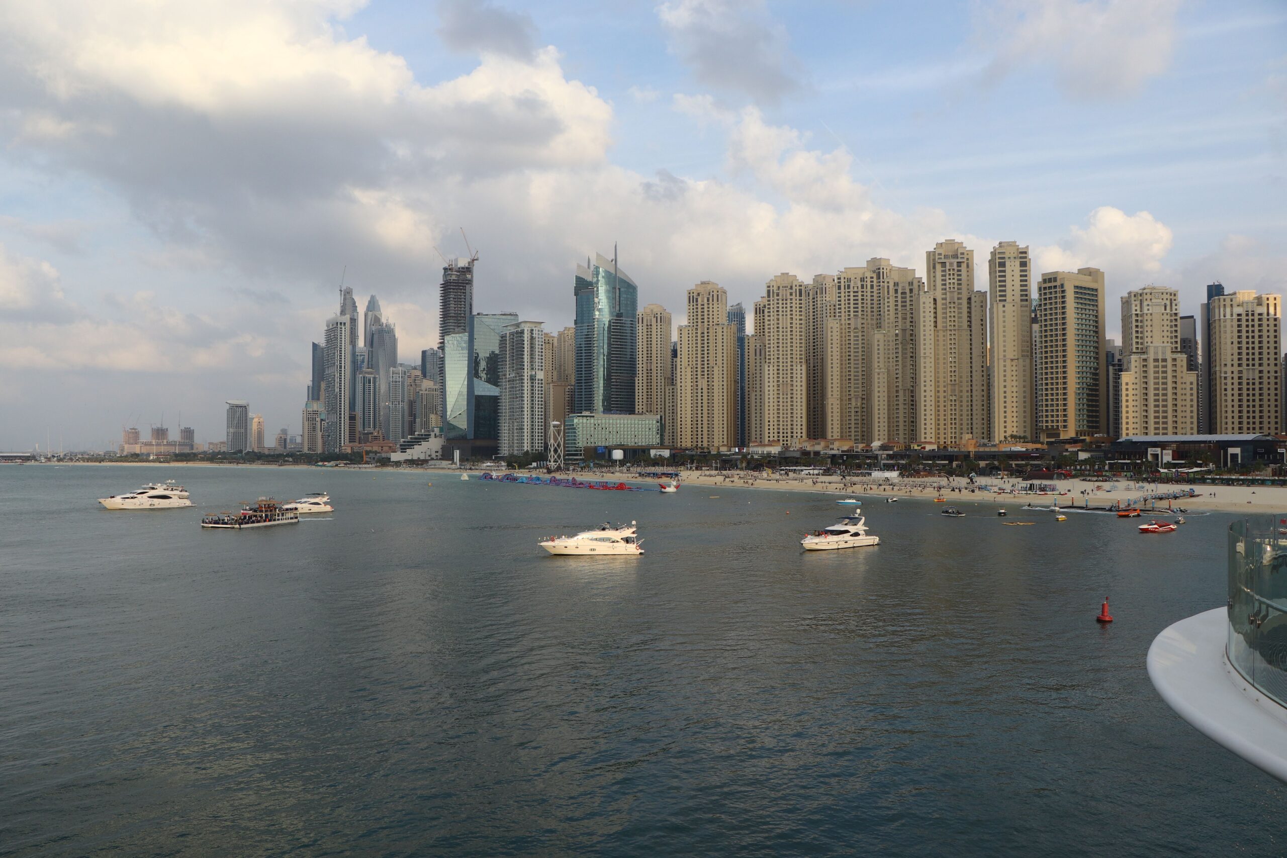 Dubai Marina and JBR skyline with yachts on the water near Palace Beach Residence Tower 1, Emaar Beachfront