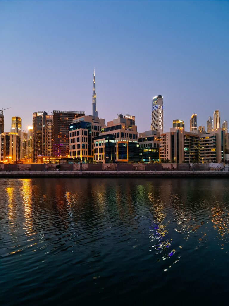 Dubai Water Canal skyline at twilight with the Burj Khalifa reflecting in the water, Business Bay