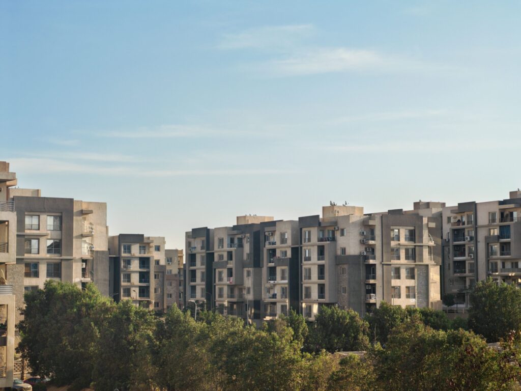 Modern low-rise Dubai residential apartment cluster surrounded by landscaped greenery, similar to MAG 900 in MAG City, MBR City