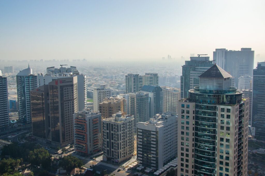 Aerial daytime view of a modern mixed-height Dubai residential district skyline, evoking the Dubai Hills Estate neighbourhood where Park Horizon is located