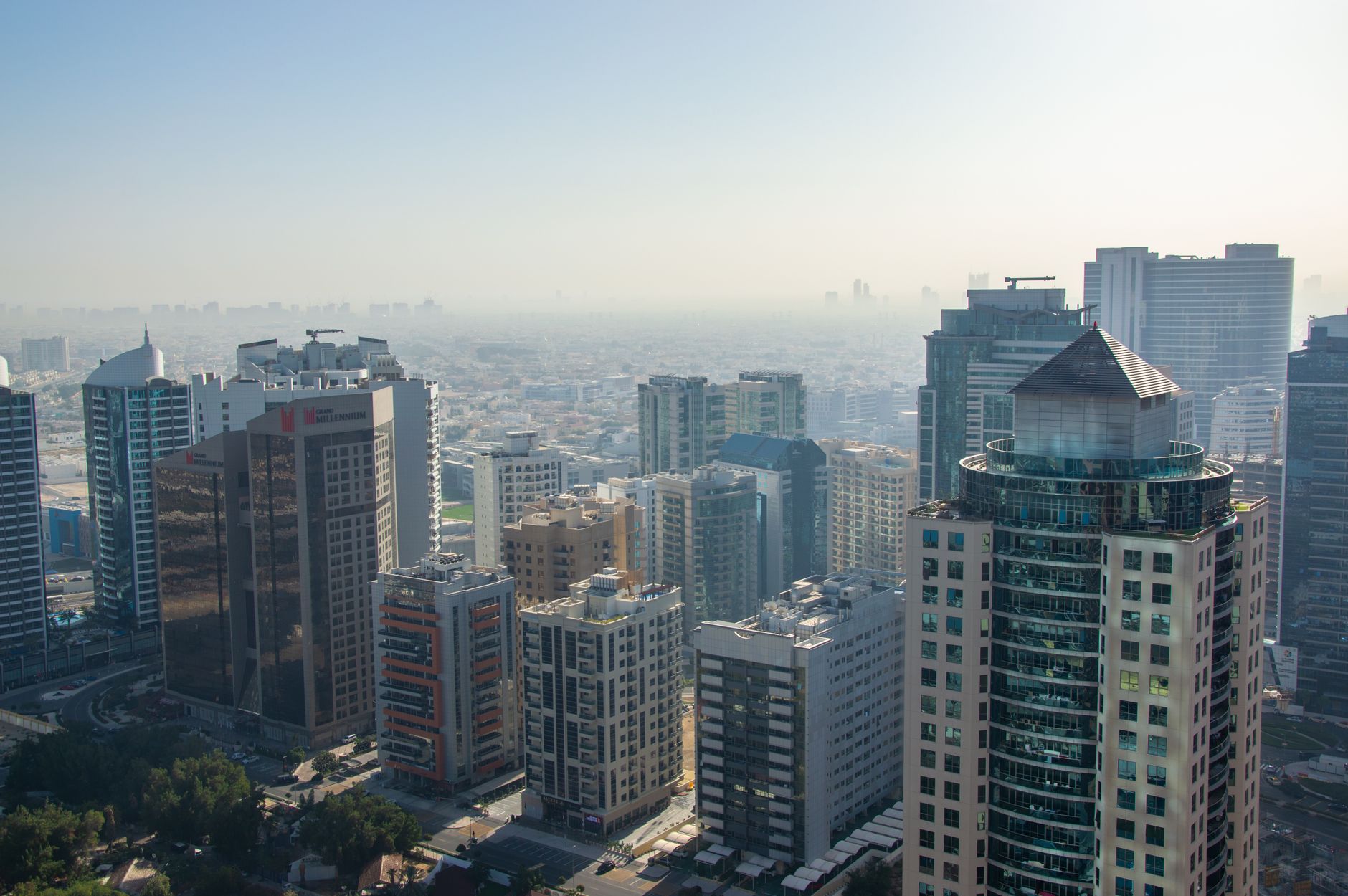 Aerial daytime view of a modern mixed-height Dubai residential district skyline, evoking the Dubai Hills Estate neighbourhood where Park Horizon is located