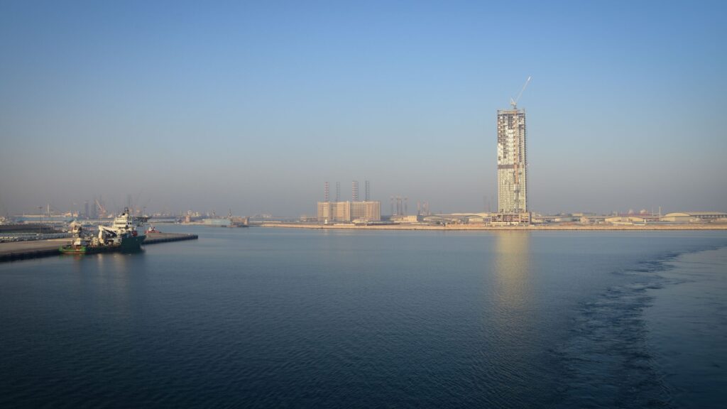 Residential tower under construction on a Dubai waterfront, near Lyvia by Palace, Dubai Creek Harbour