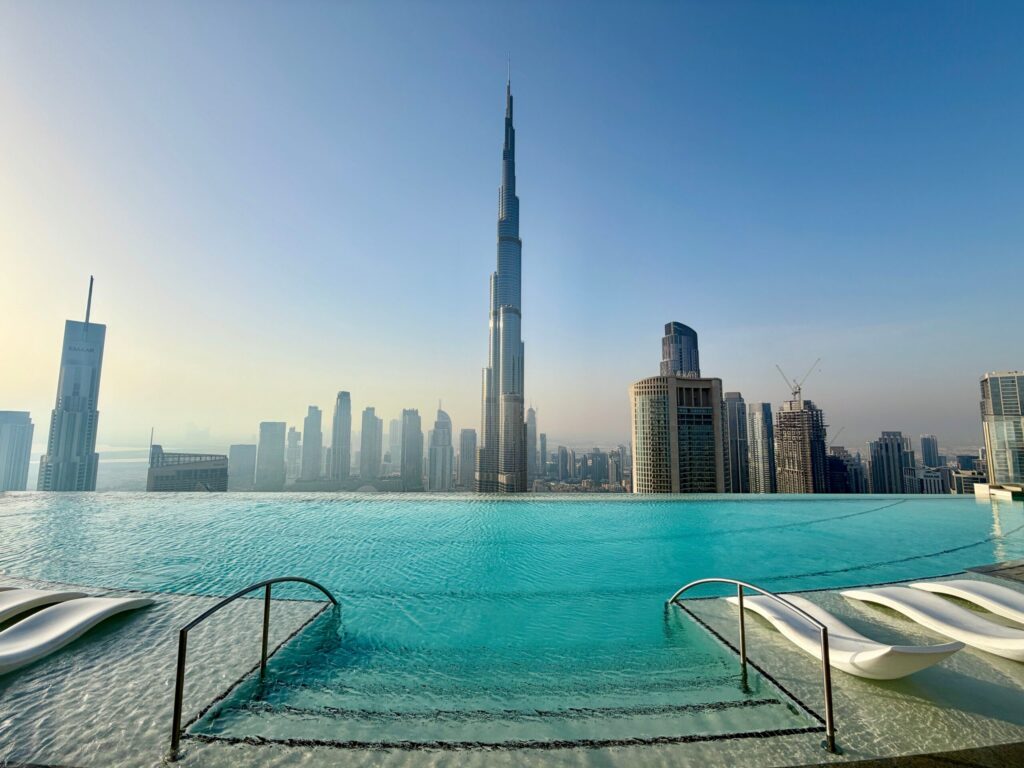 Infinity pool overlooking Burj Khalifa and the Dubai skyline, echoing Park Lane's own resort-style pool amenity in Dubai Hills Estate