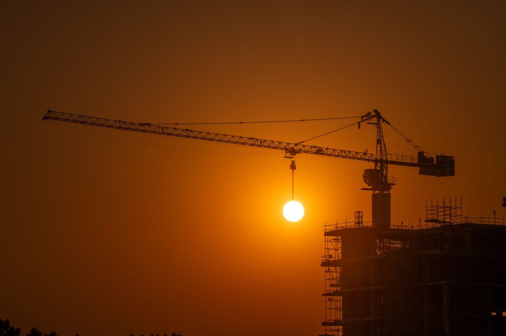 Construction crane against the sky above a high-rise development in Business Bay, Dubai