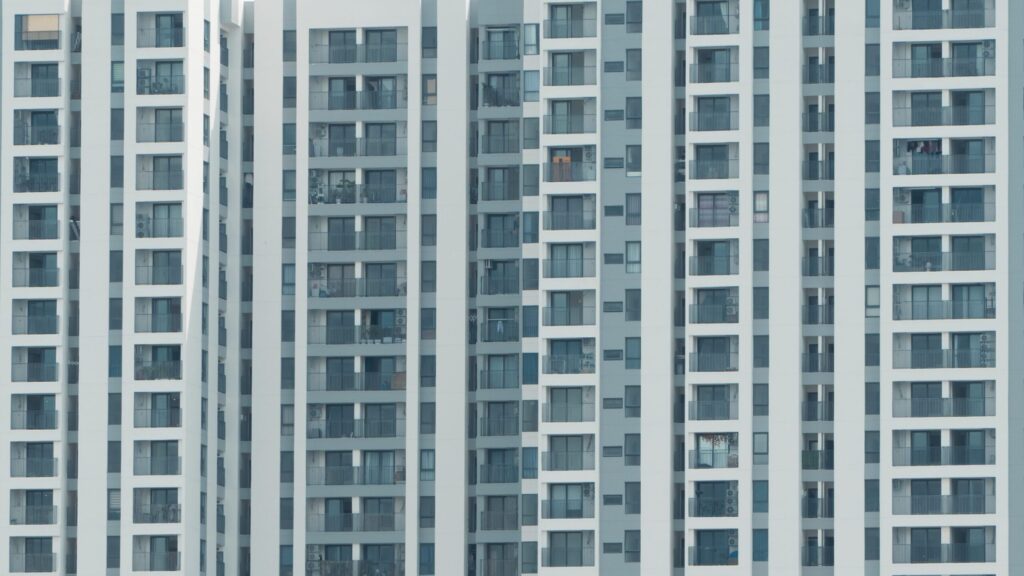 Modern high-rise apartment building facade with balconies in Dubai