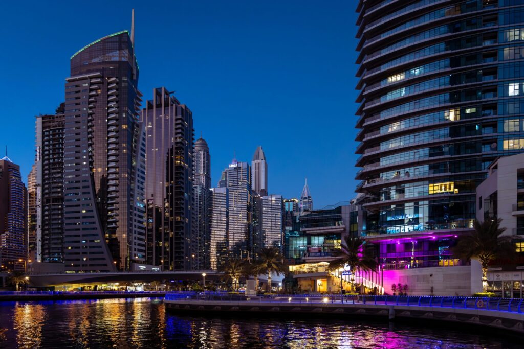 Blue hour view of Dubai Marina's waterfront skyscrapers and promenade, representative of The Jewels' setting on the Marina waterfront