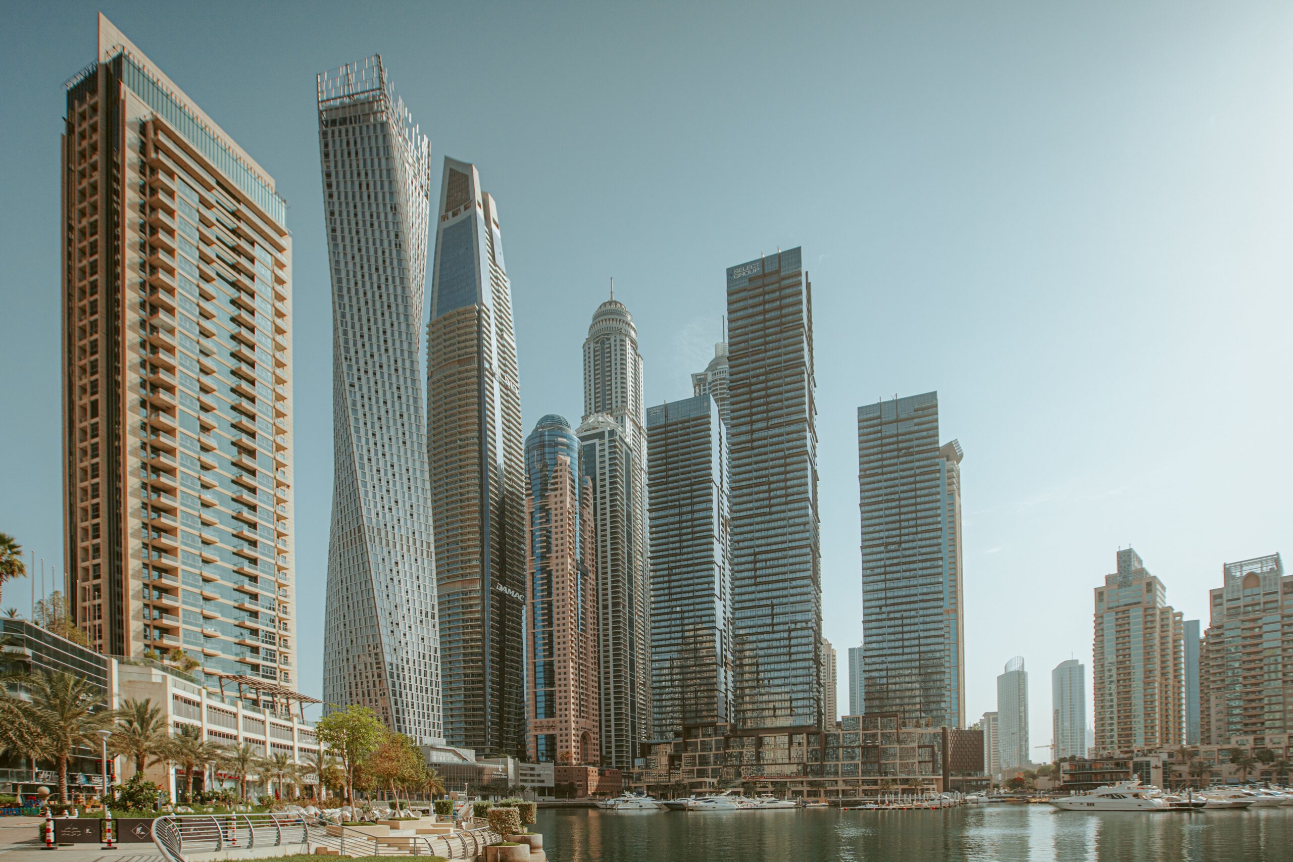 Daytime view of Dubai Marina's twisted Cayan Tower and waterfront skyline near Pelagos by IGO