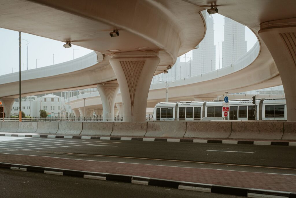 Modern overpass and metro line running through the Dubai urban landscape