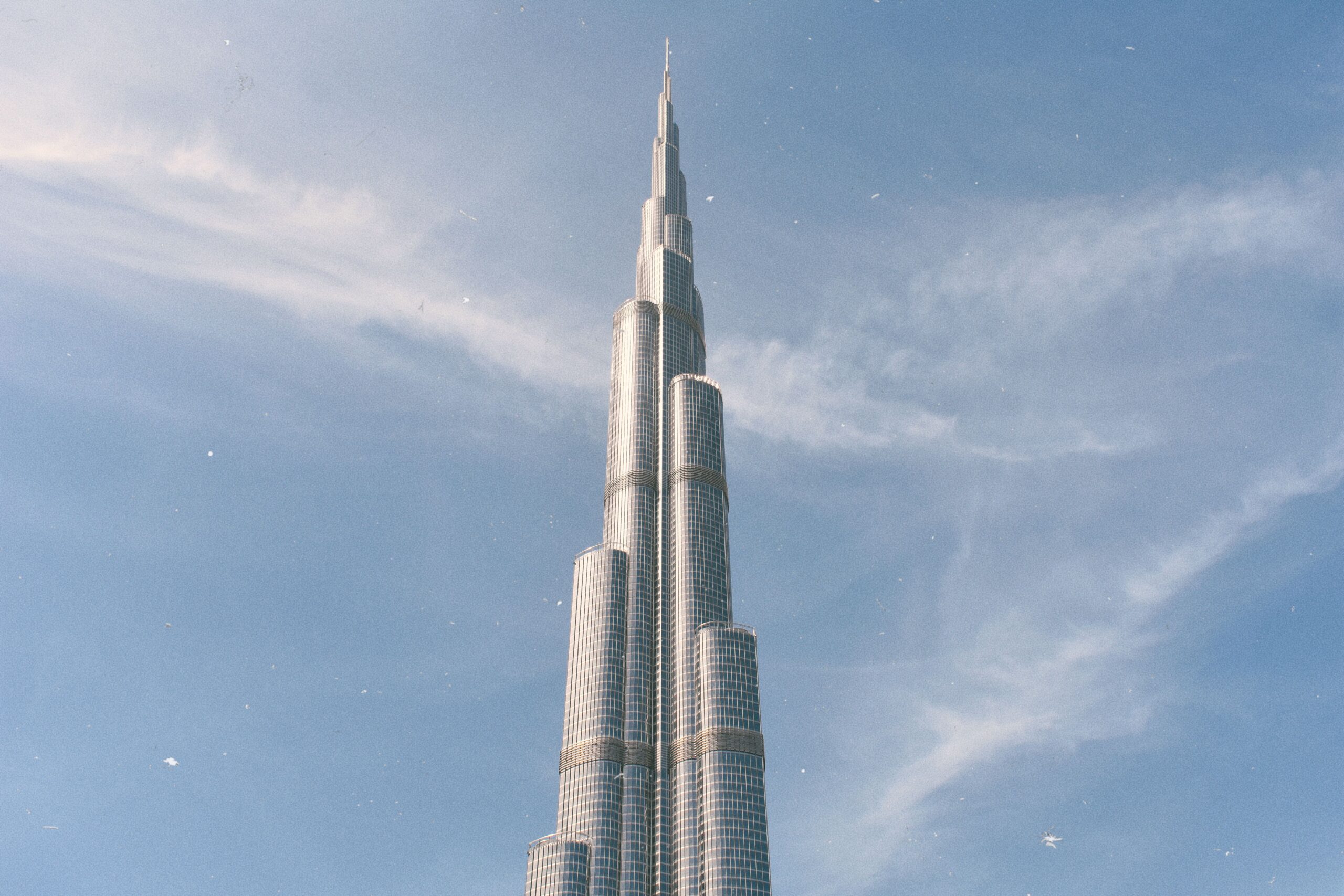 Burj Khalifa and the Downtown Dubai skyline in daylight, near Fairmont Residences Solara Tower