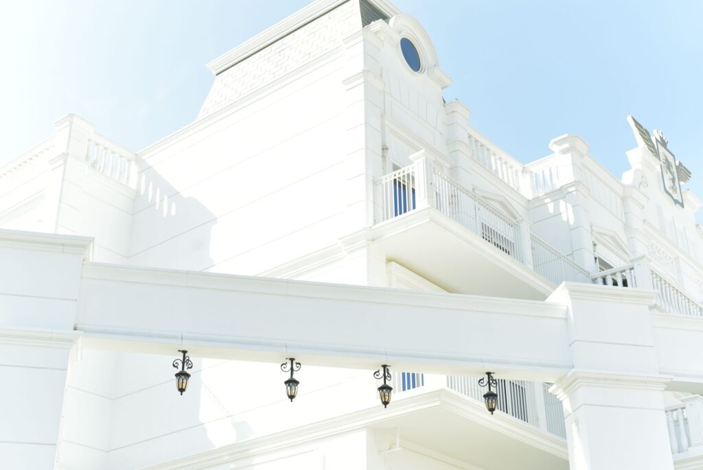 White classical-style villa facade with ornate detailing, representative of the Classic architectural style at Address Villas Hillcrest, Dubai Hills Estate
