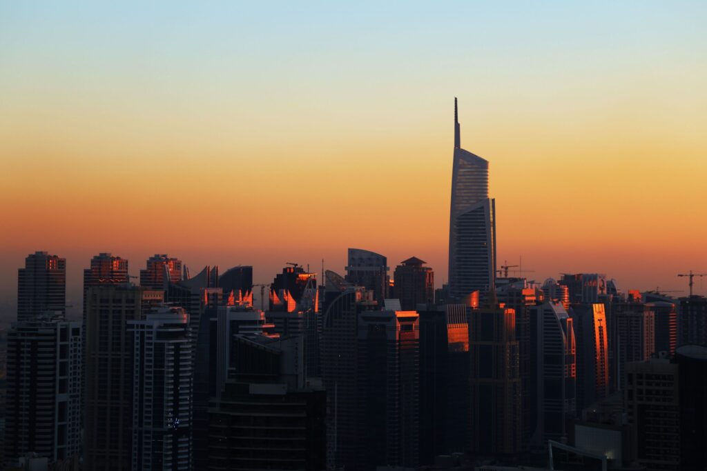 Dubai skyline silhouetted at sunset, representative of the wider Dubai skyline visible from Golf Residences by Fortimo in Dubai Hills Estate
