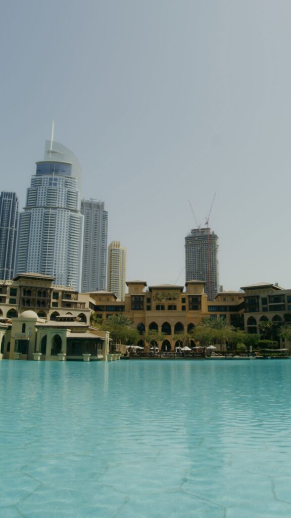 Old Town Island waterfront in Downtown Dubai with Arabic-style sandstone buildings and a skyscraper skyline