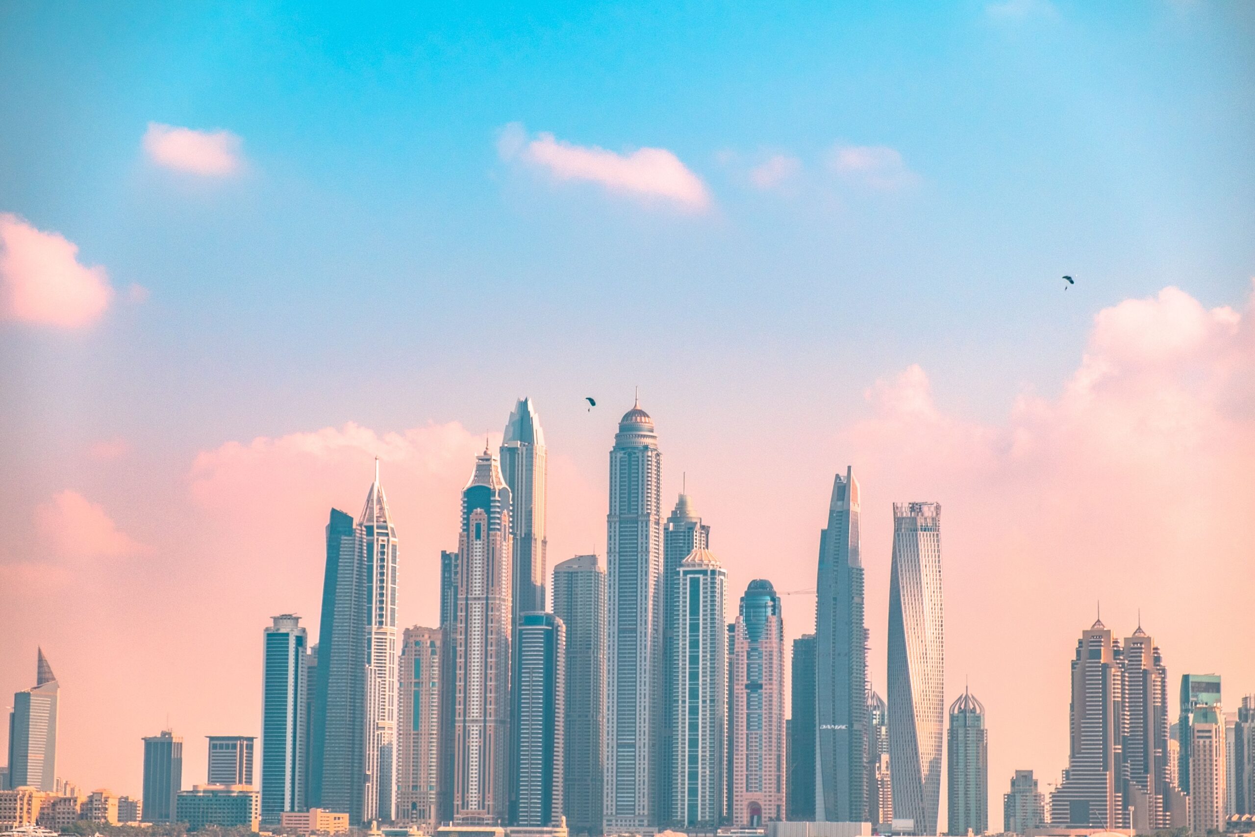 Dubai residential towers against a pastel sky