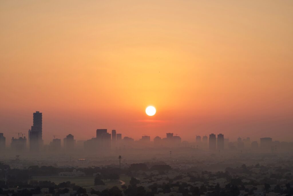 Dubai skyline at sunrise seen through morning haze